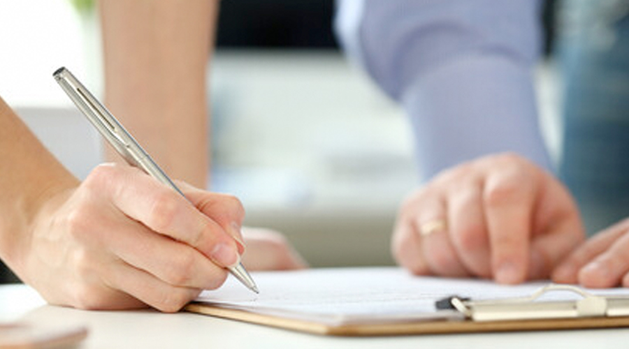 People signing documents