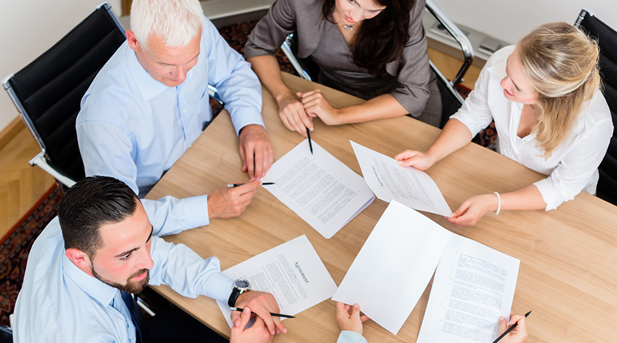 People sitting around a conference table